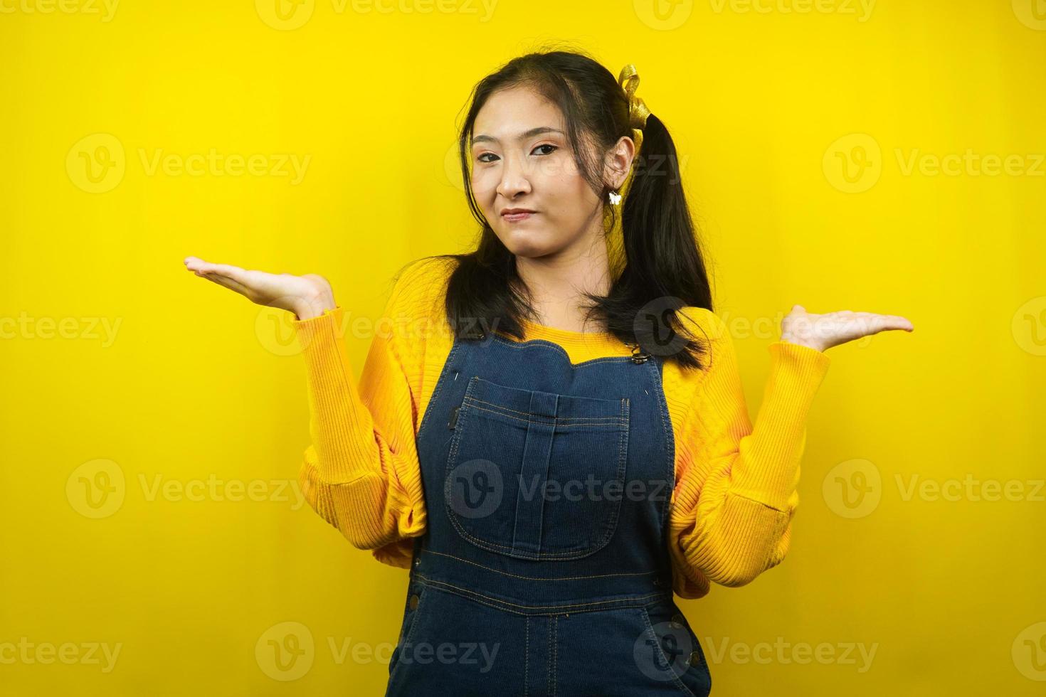 Pretty and cute young woman with expression I don't know, isolated photo