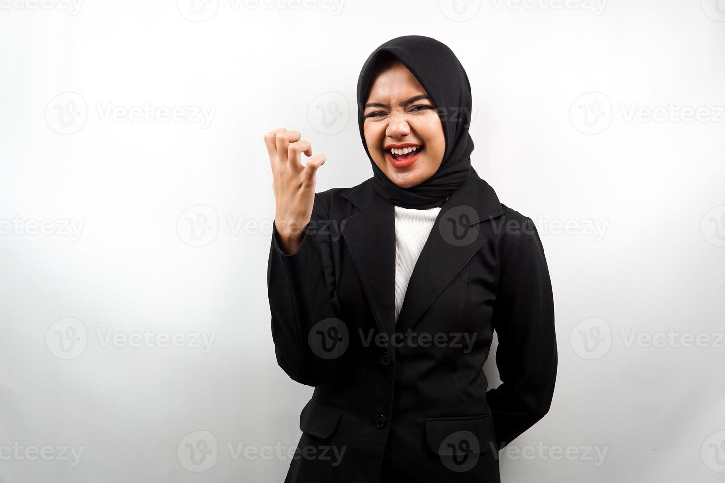 Beautiful young asian muslim business woman upset, angry, dissatisfied, displeased, hateful, looking at camera isolated on white background photo