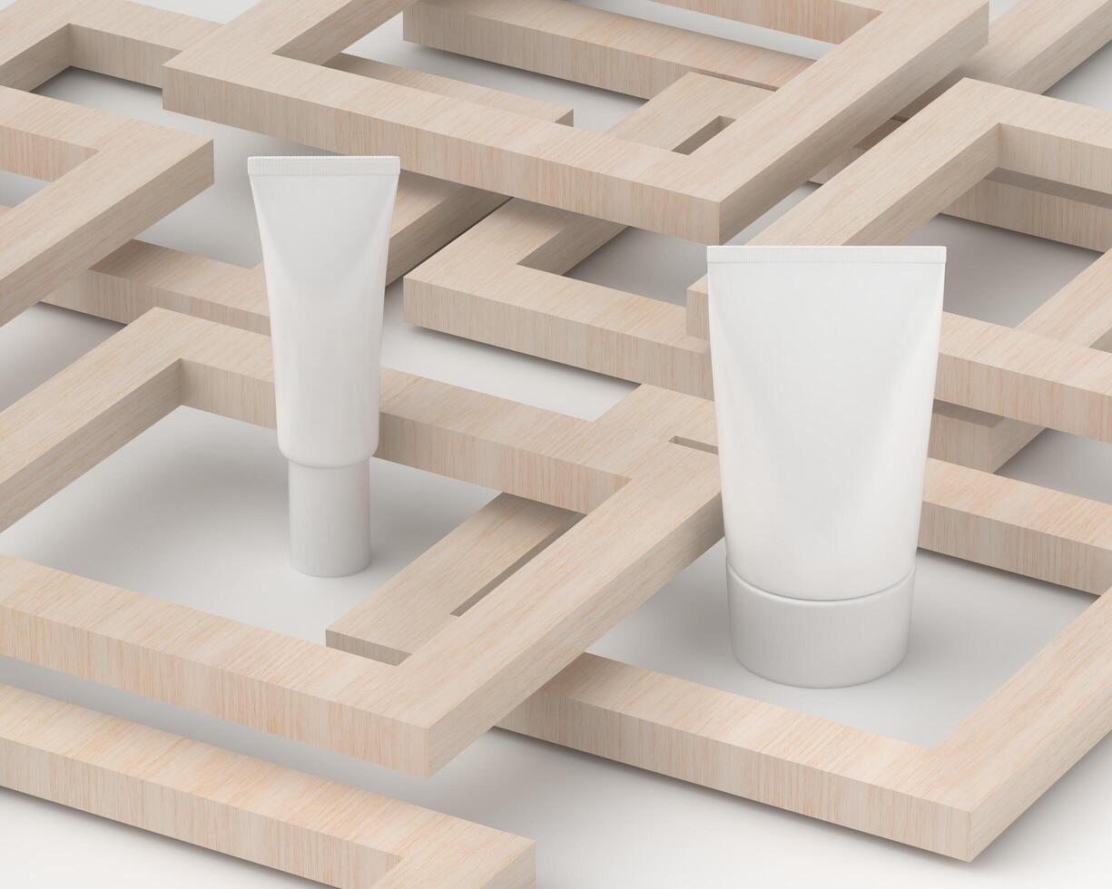 Squeeze tube for applying cream or makeup on white background and wooden block. photo
