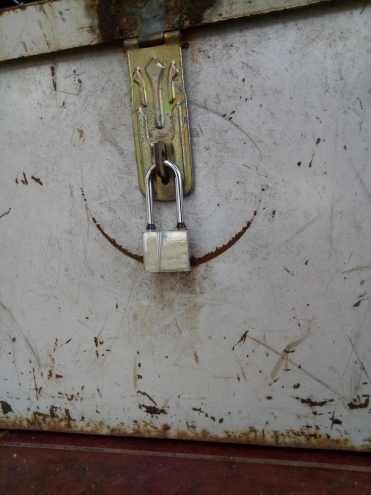 Small padlock in metal safe photo