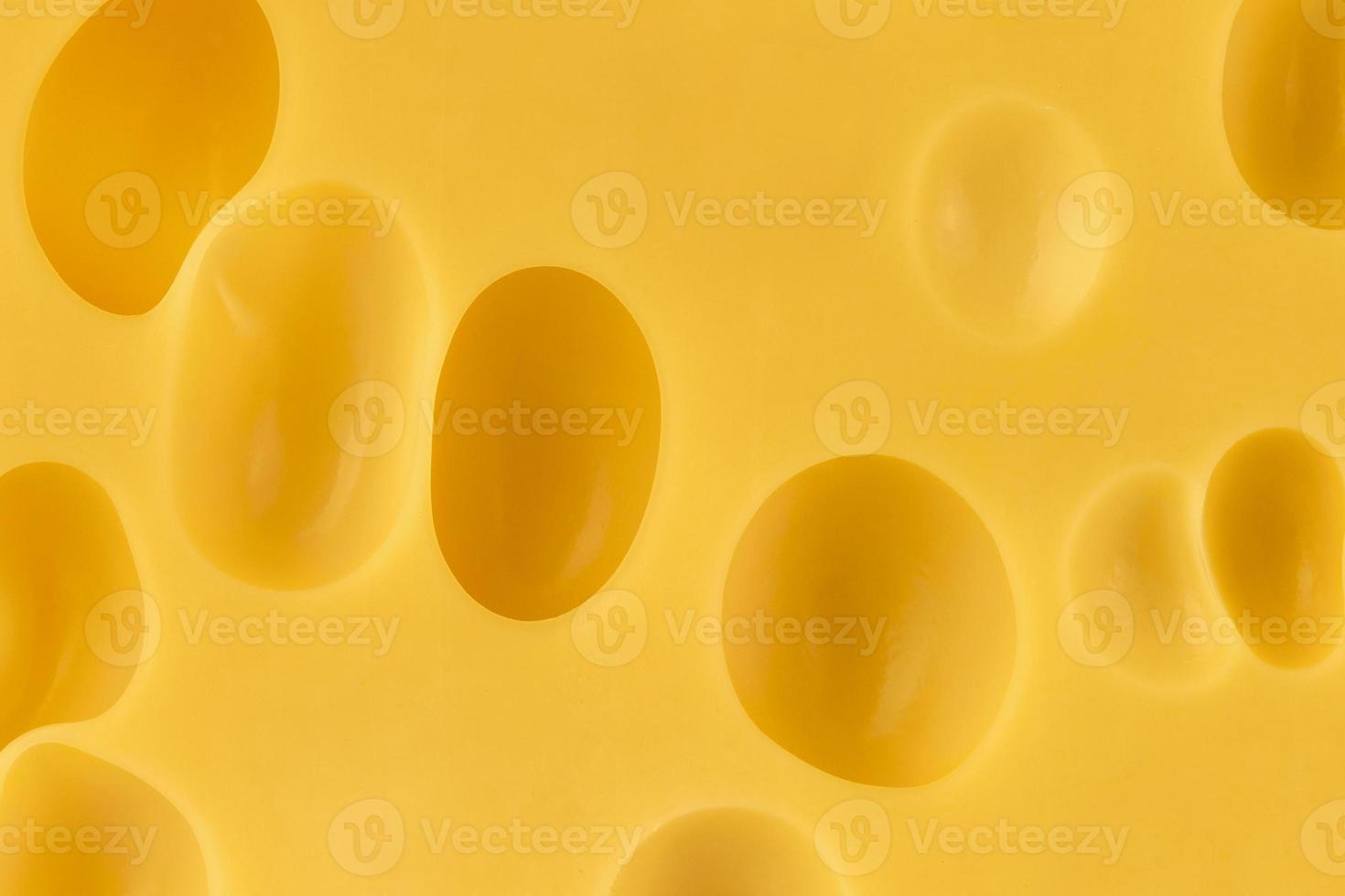 Texture of swiss cheese, close-up photo