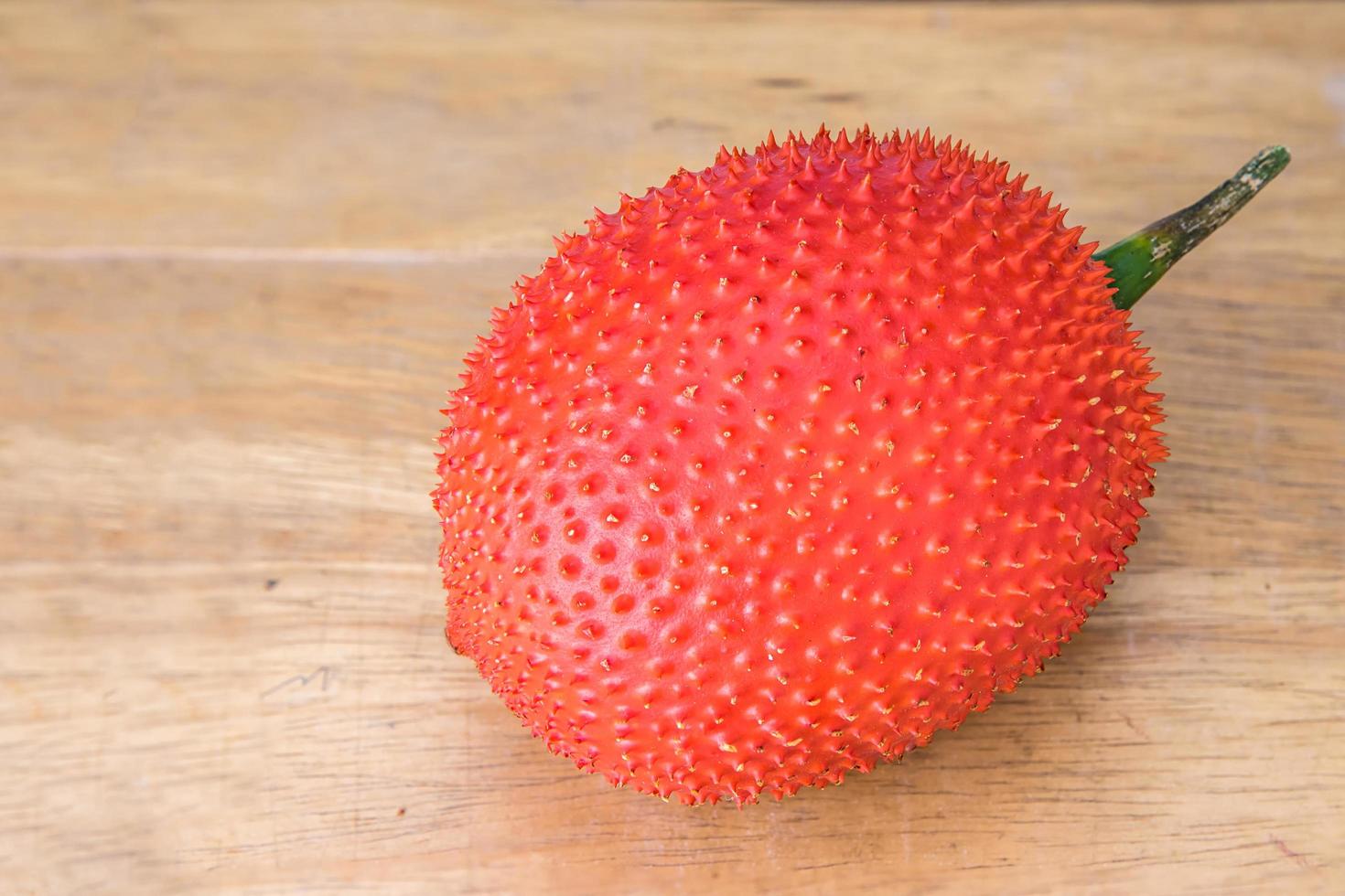 Gac fruit on table photo