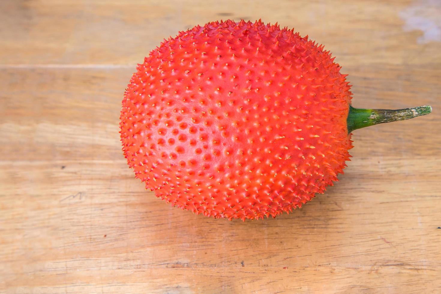 Gac fruit on table photo