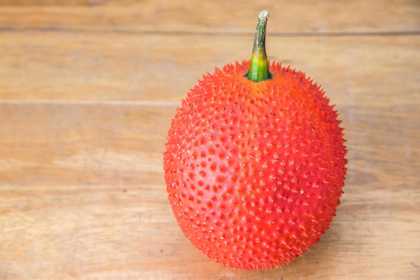 Gac fruit on table photo