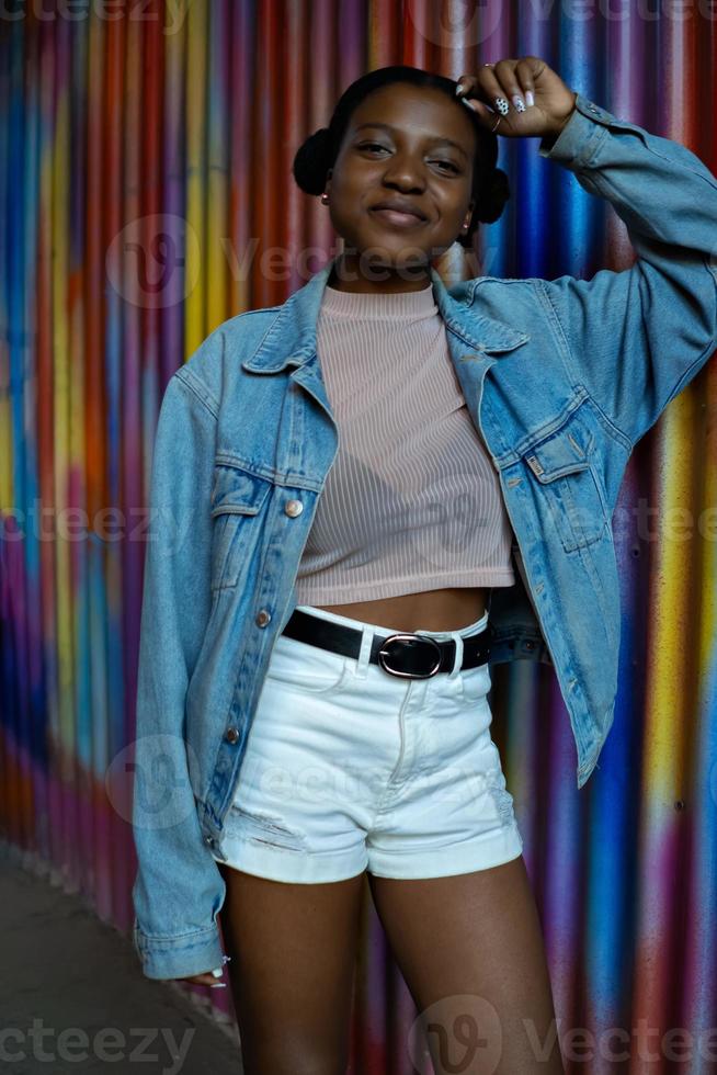 Cool black girl with curly hair. Retro hip hop style photo