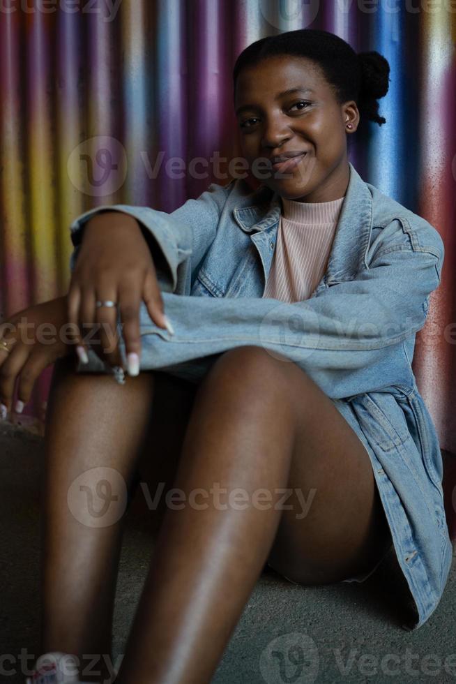 Smiling young african american woman looking at camera. photo
