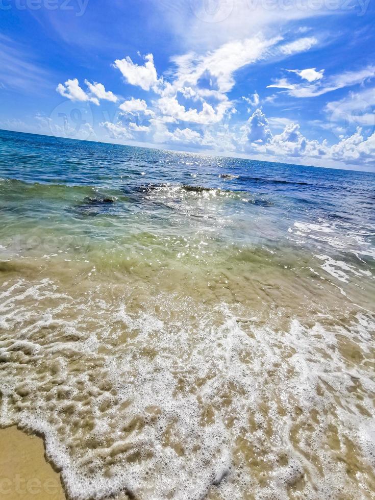 Turquoise clear water boulders stones mexican beach del Carmen Mexico. photo