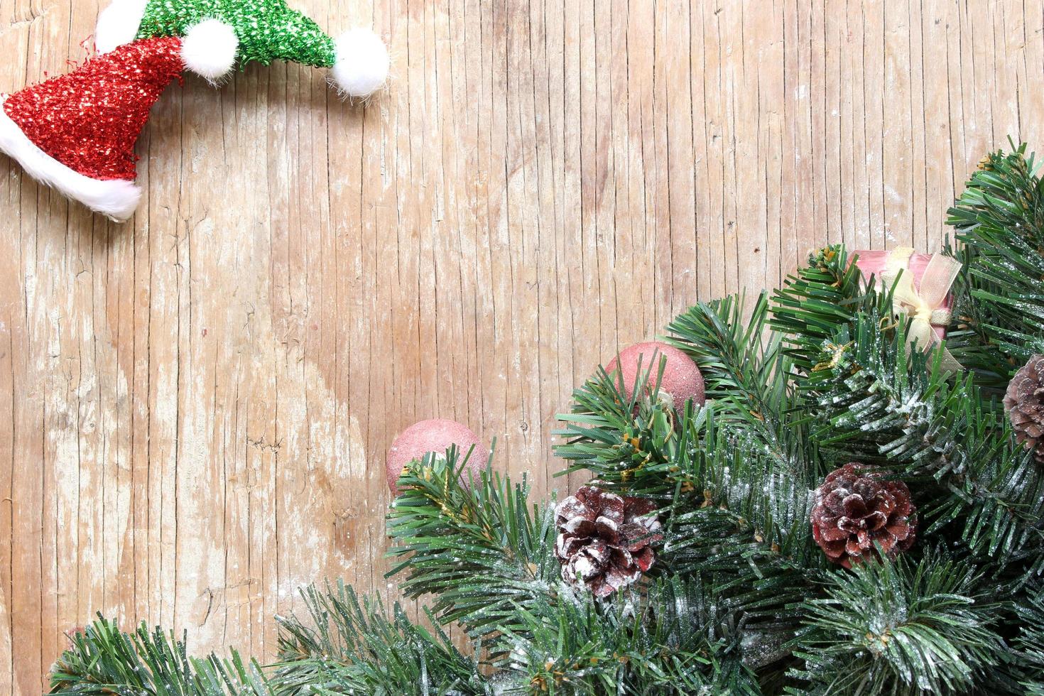 christmas tree background with decorations on wooden board photo