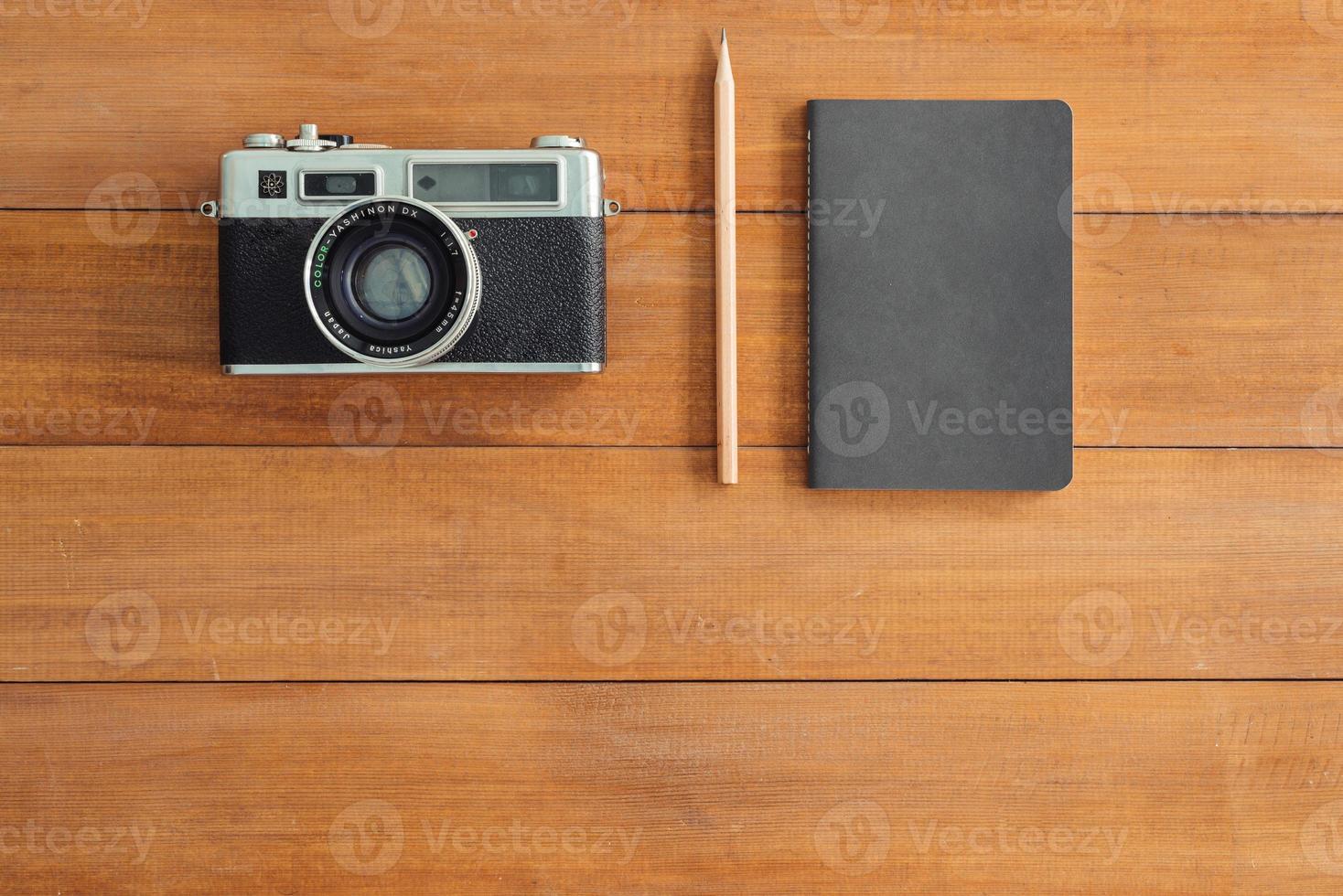 Minimal work space - Creative flat lay photo of workspace desk. Office desk wooden table background with mock up notebooks and retro camera. Top view with copy space, flat lay photography