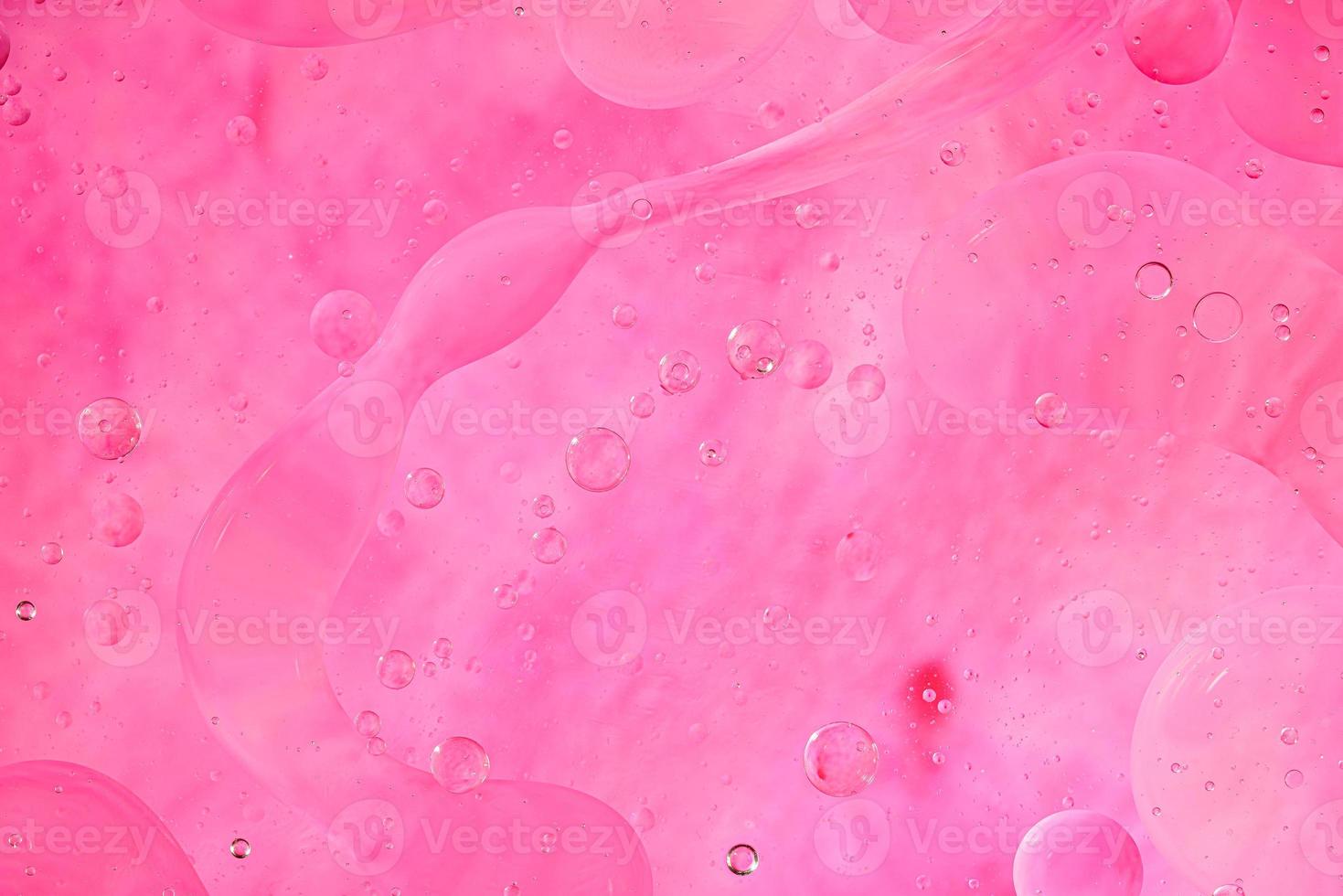 Photo of oil on a water surface with bubbles.soft pink. Abstract colorful background.