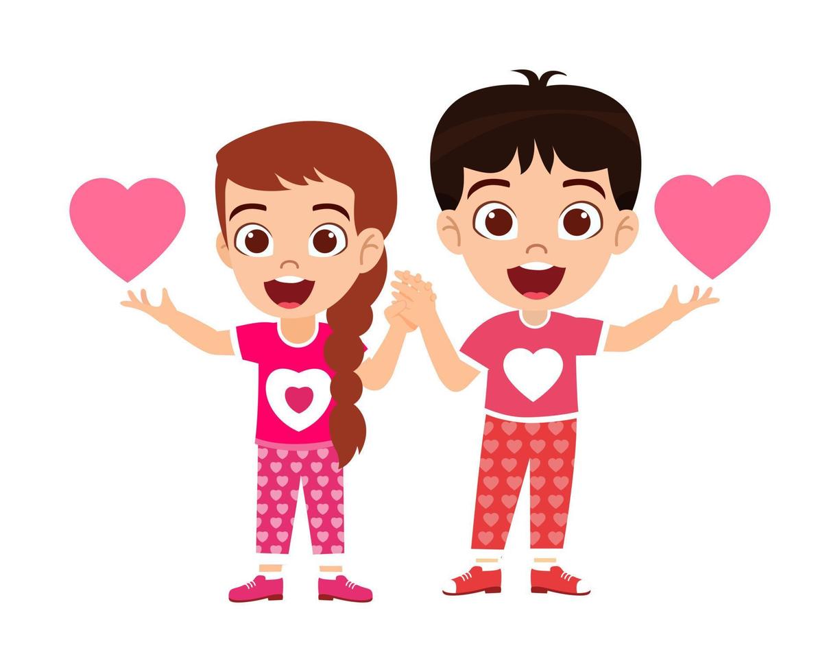 Happy cute kid boy and girl character standing and holding hands together and waving with hart shape symbol isolated vector