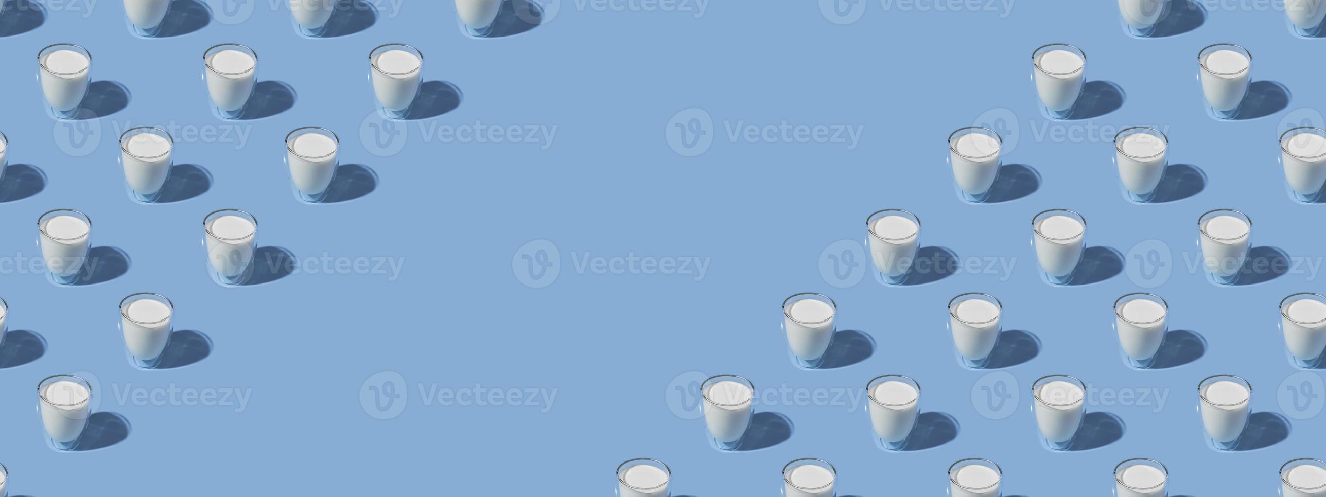 World Milk Day. Pattern on a blue background. A glass of milk. Sample. With space for text. copy space. Banner photo