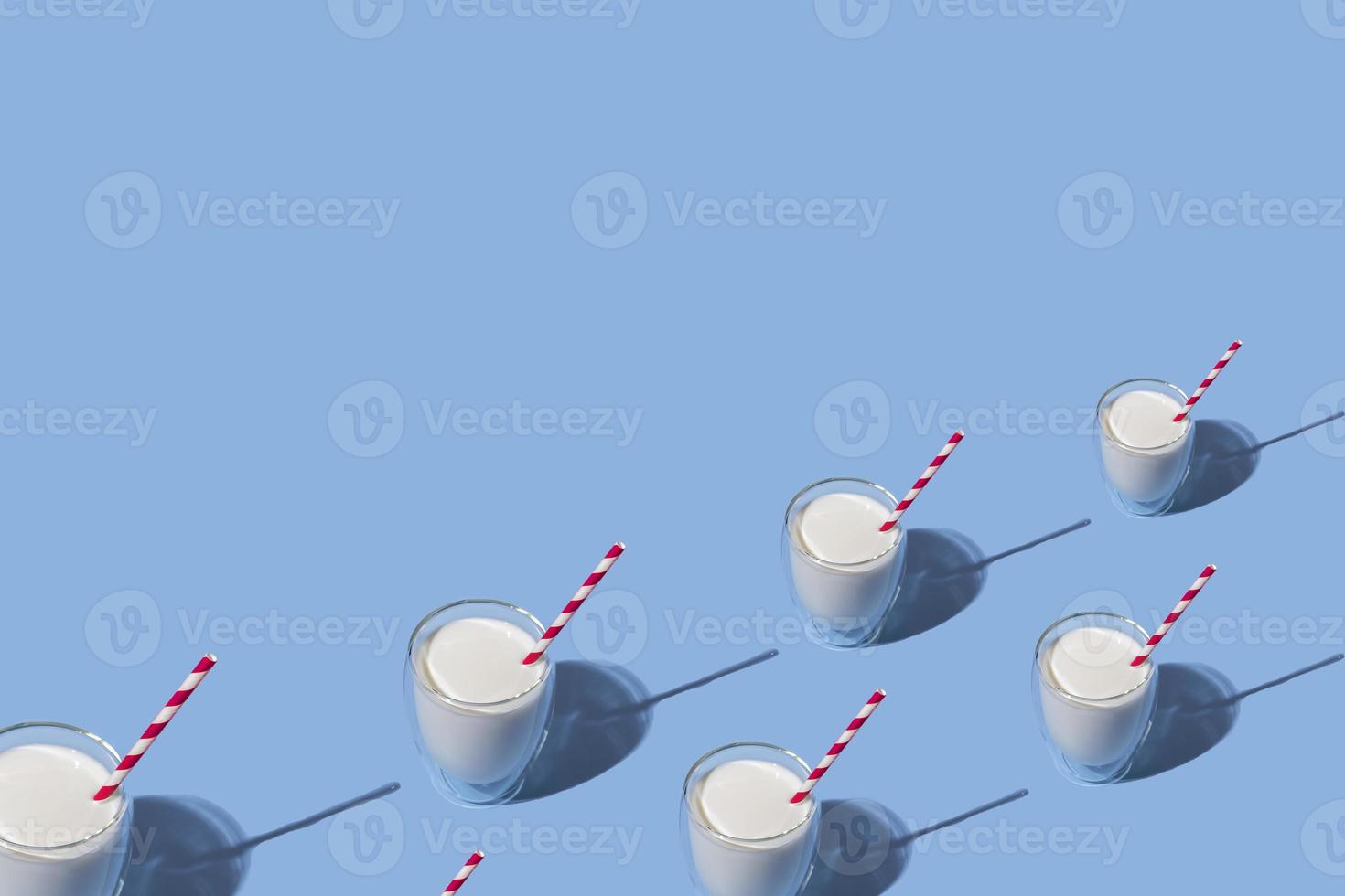 World Milk Day. Glass of milk with a red straw against a blue background. Seamless pattern. Sample. Package. photo