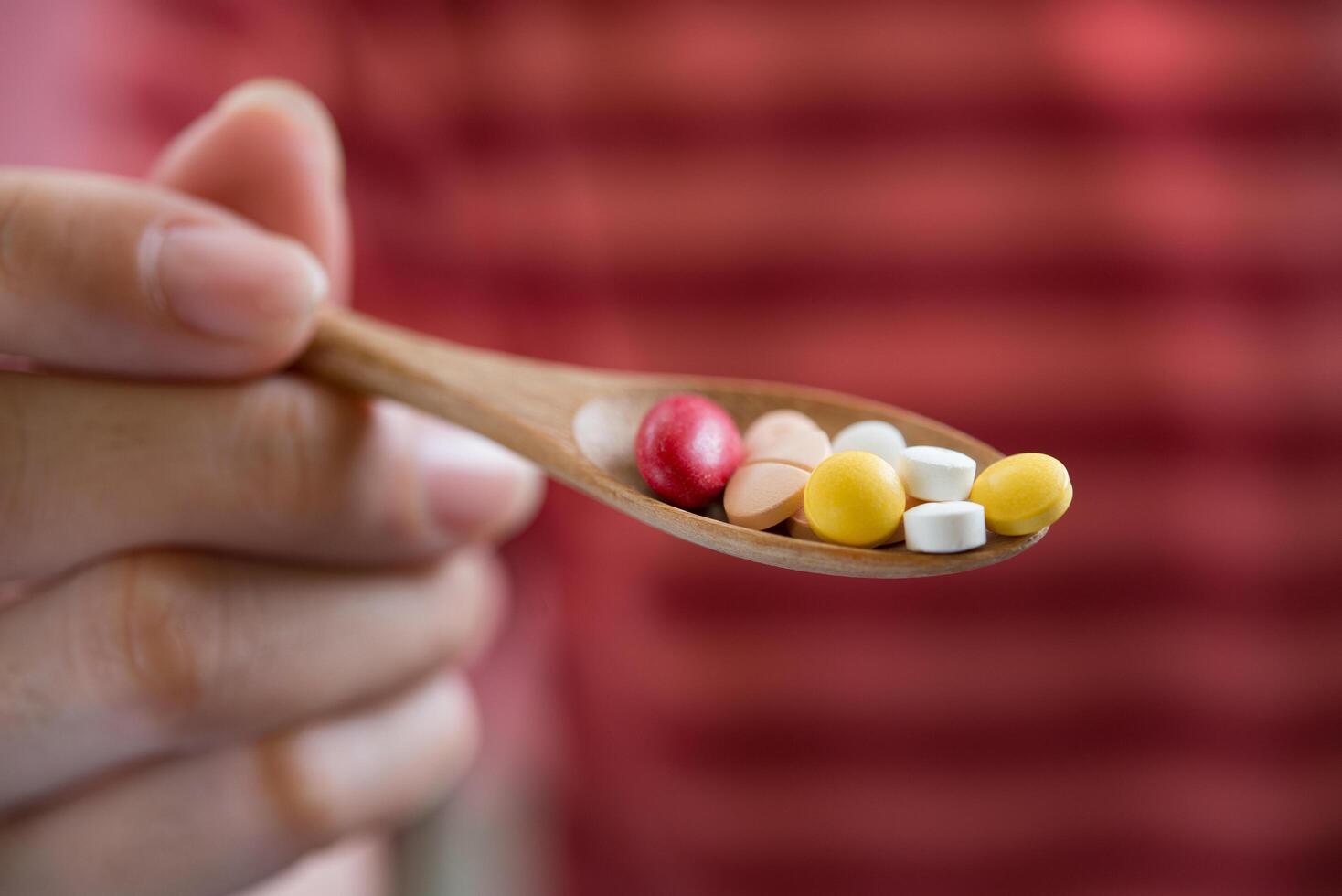 woman hand holding a pills take medicine according to the doctor's order photo