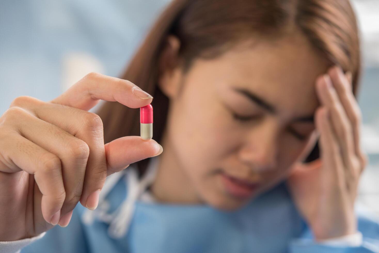 woman hand holding a pills take medicine according to the doctor's order photo