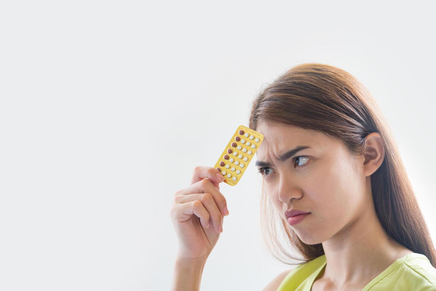 Woman hand holding a contraceptive panel prevent pregnancy photo