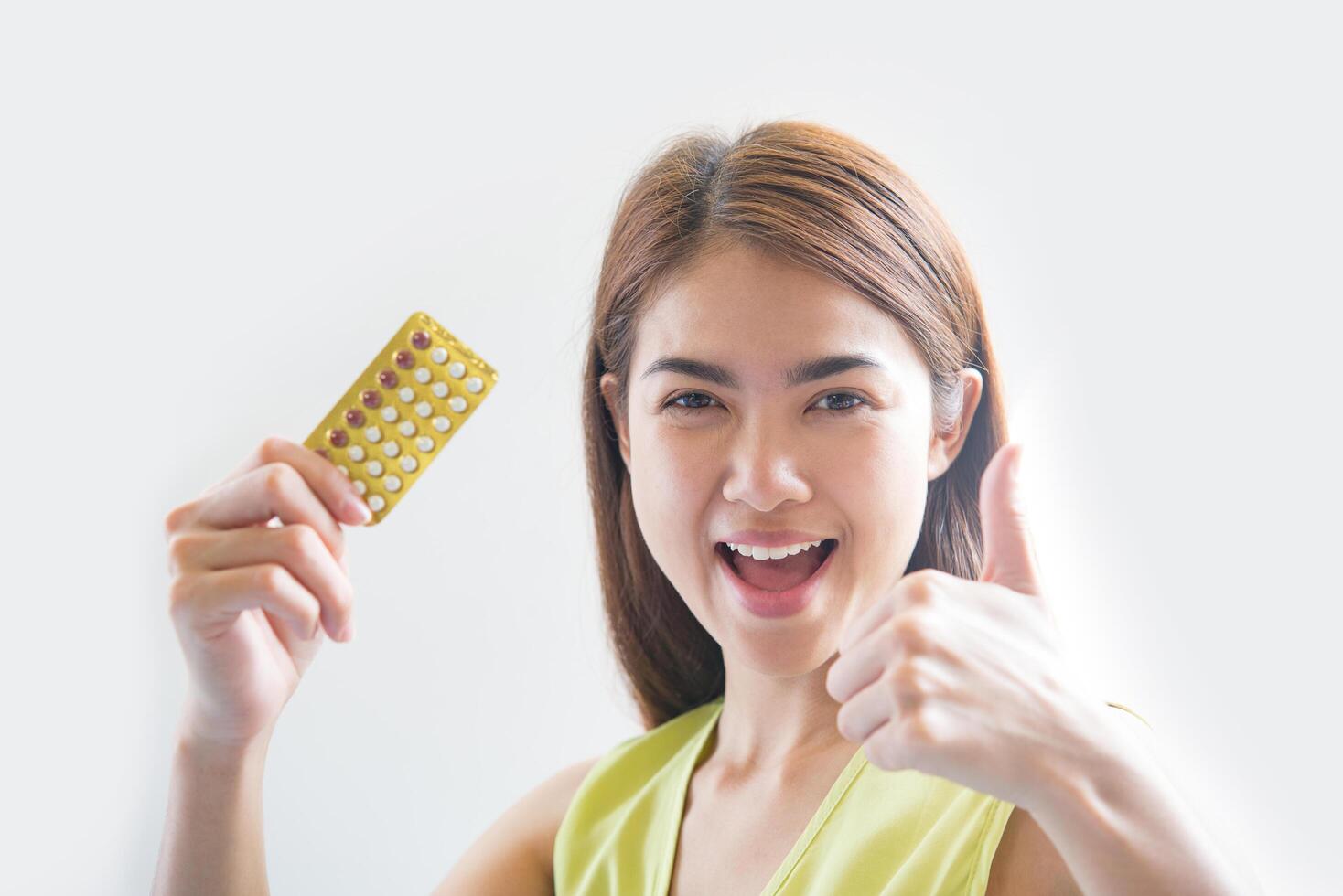 Woman hand holding a contraceptive panel prevent pregnancy photo
