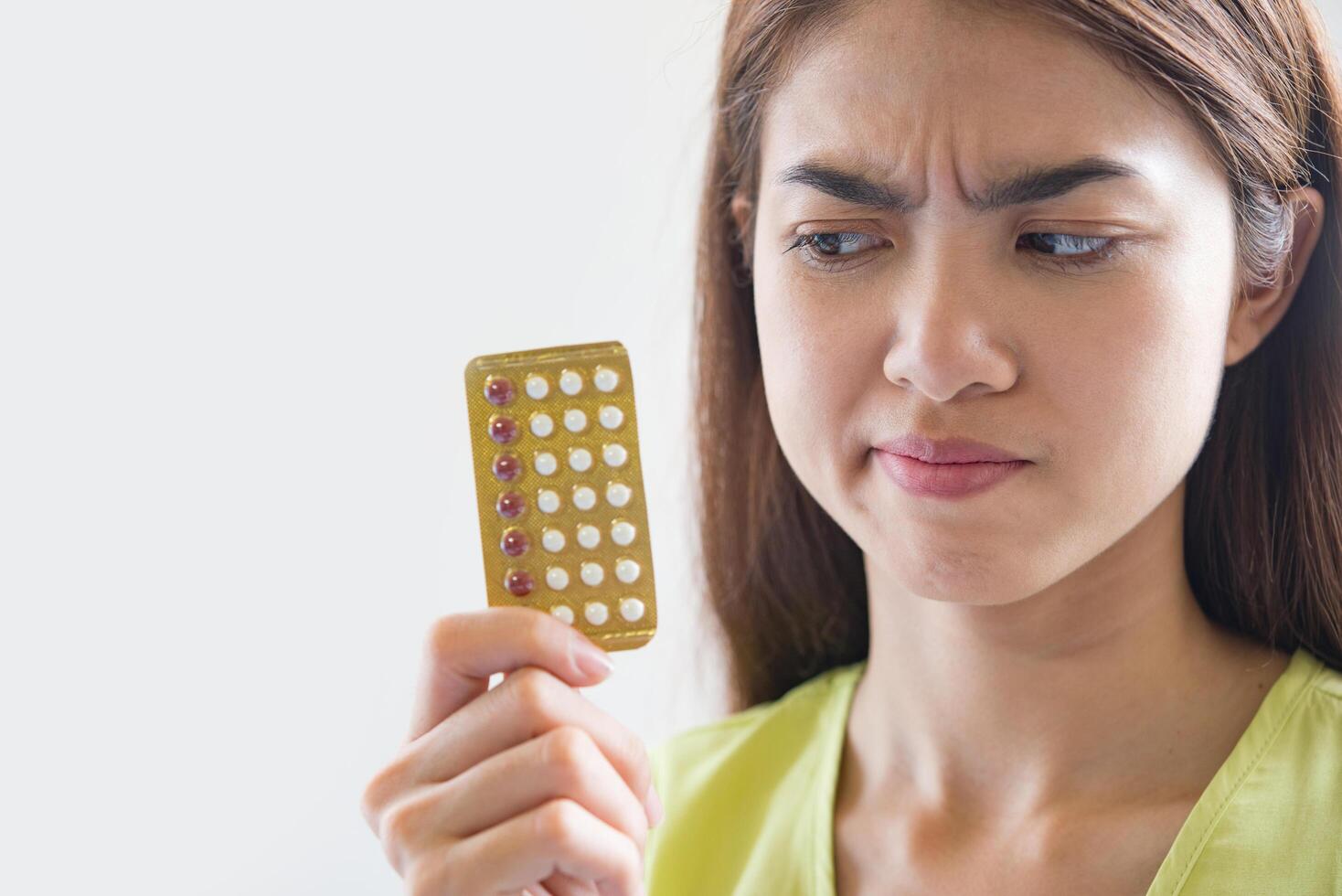 Woman hand holding a contraceptive panel prevent pregnancy photo