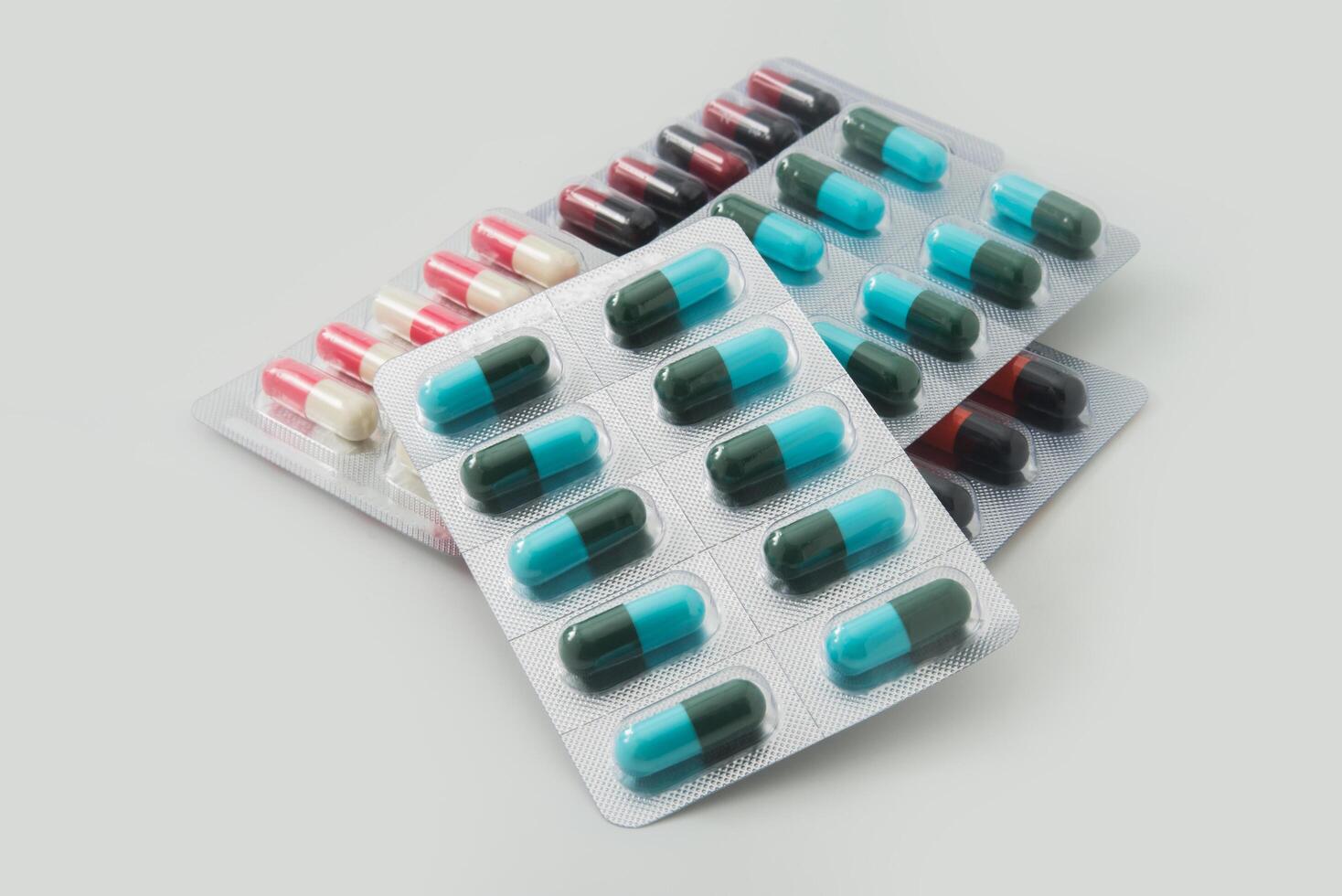 Panel of capsules medicine pills from doctor order photo