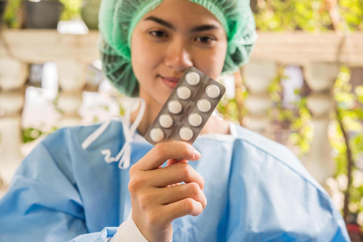 Woman pharmacist holding prescription medicine from doctor order photo