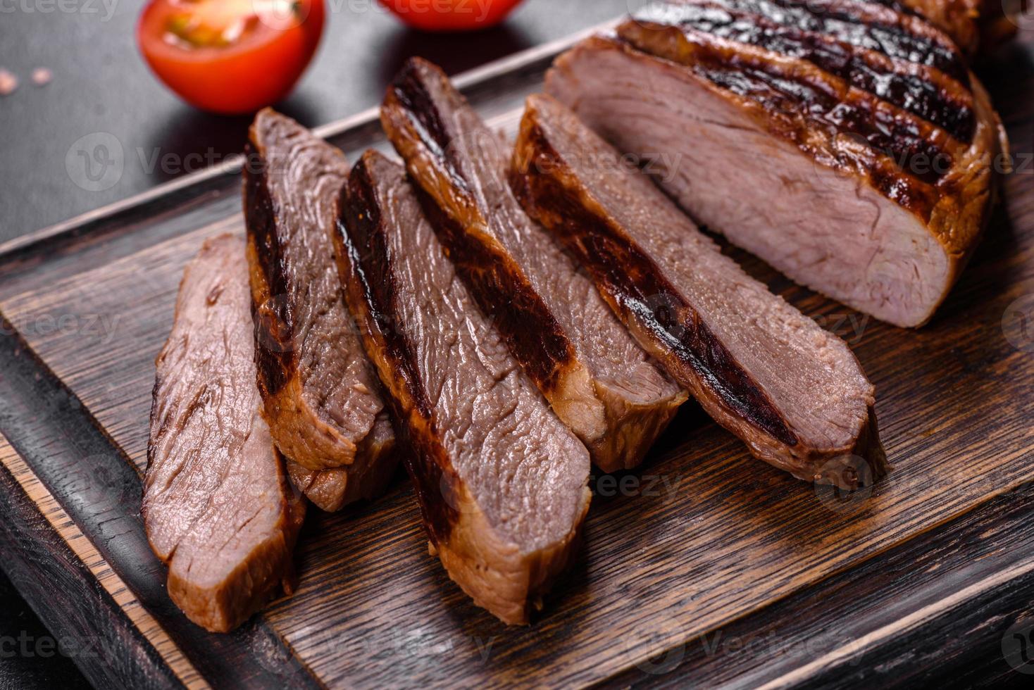 Cooked grilled Chuck eye roll steak on a chopping Board 4768251 Stock