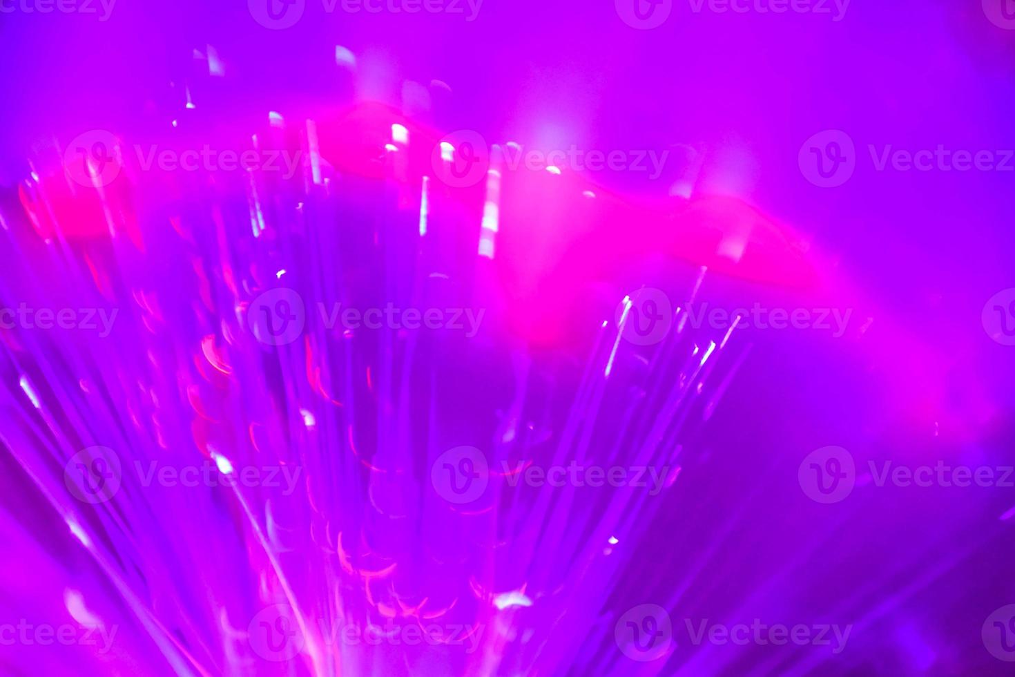 light purple neon light abstract Neon bright lens flare colored on black background.dark abstract futuristic background and Neon photo