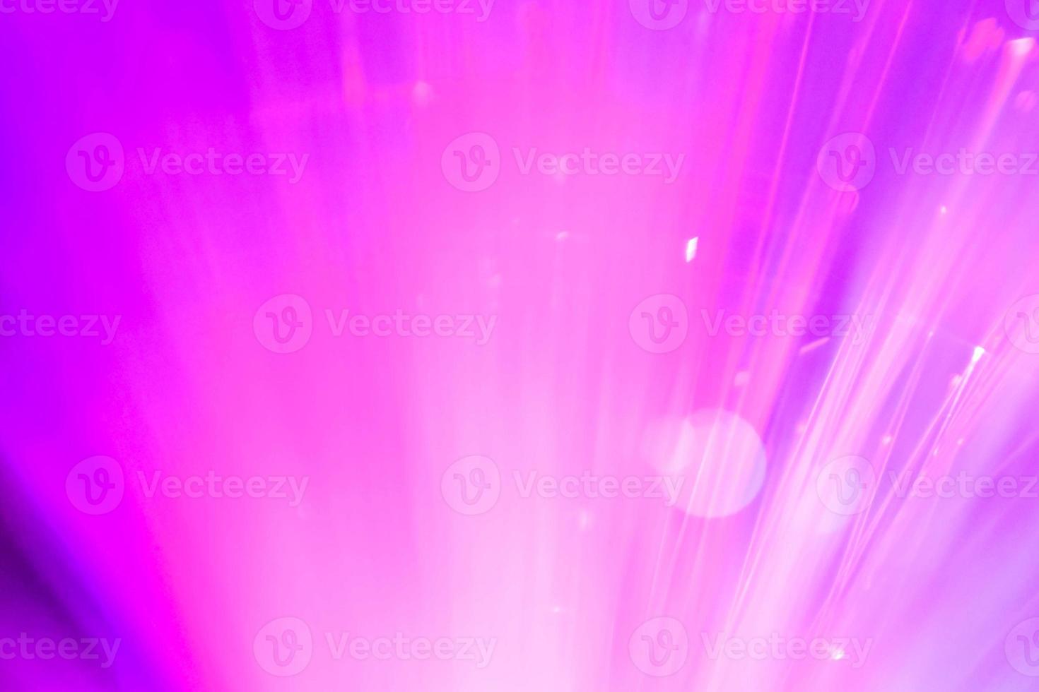 light purple neon light abstract Neon bright lens flare colored on black background.dark abstract futuristic background and Neon photo