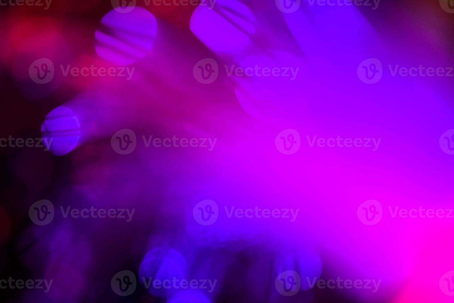 light purple neon light abstract Neon bright lens flare colored on black background.dark abstract futuristic background and Neon photo