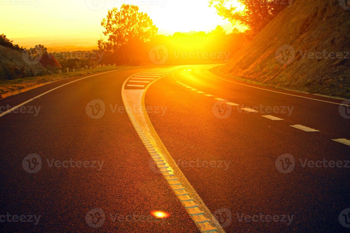 sunset orange in the road track beautiful Road turning in the hills and Mountain road grassland road in the evening in. photo