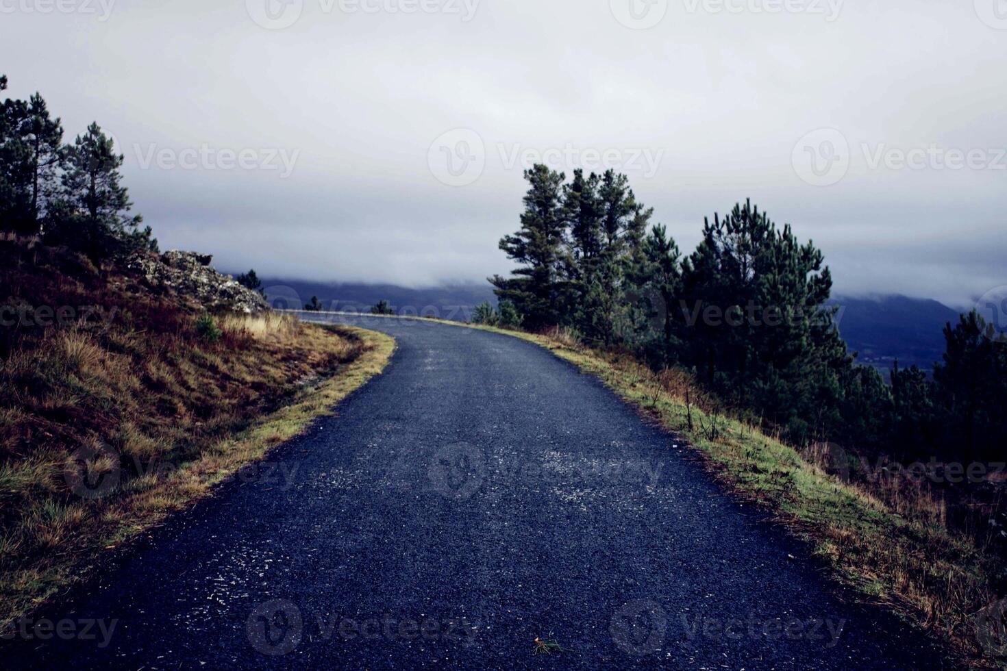 dark road beautiful Road and ways in the hills and Mountain road grassland road in the evening. photo