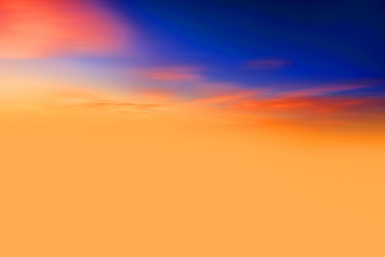 sunset and orange cloud and blue dawn sky with cloud horizontal lines motion effect on background from sunshine. photo