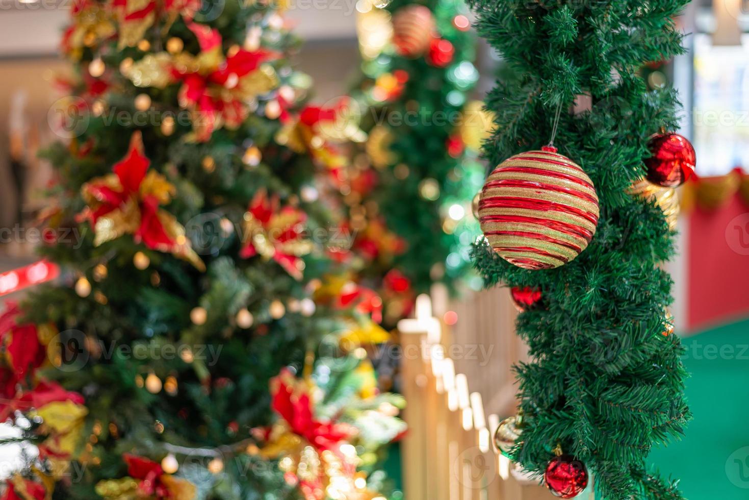 Selective focus christmas ball hanging at green grass photo