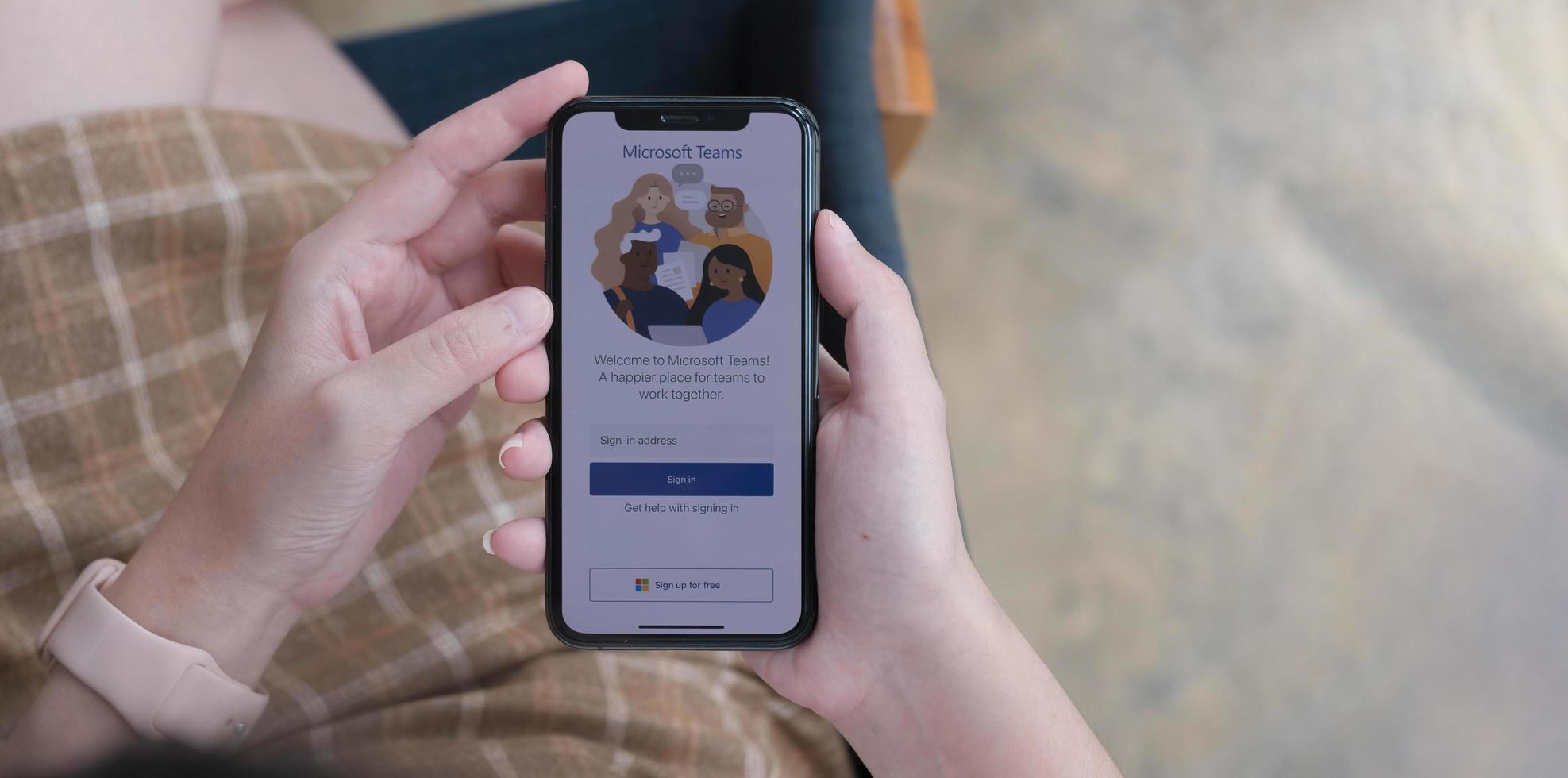 A working from home employee is downloading the Microsoft Teams social platform, ready for remote working in isolation from home photo