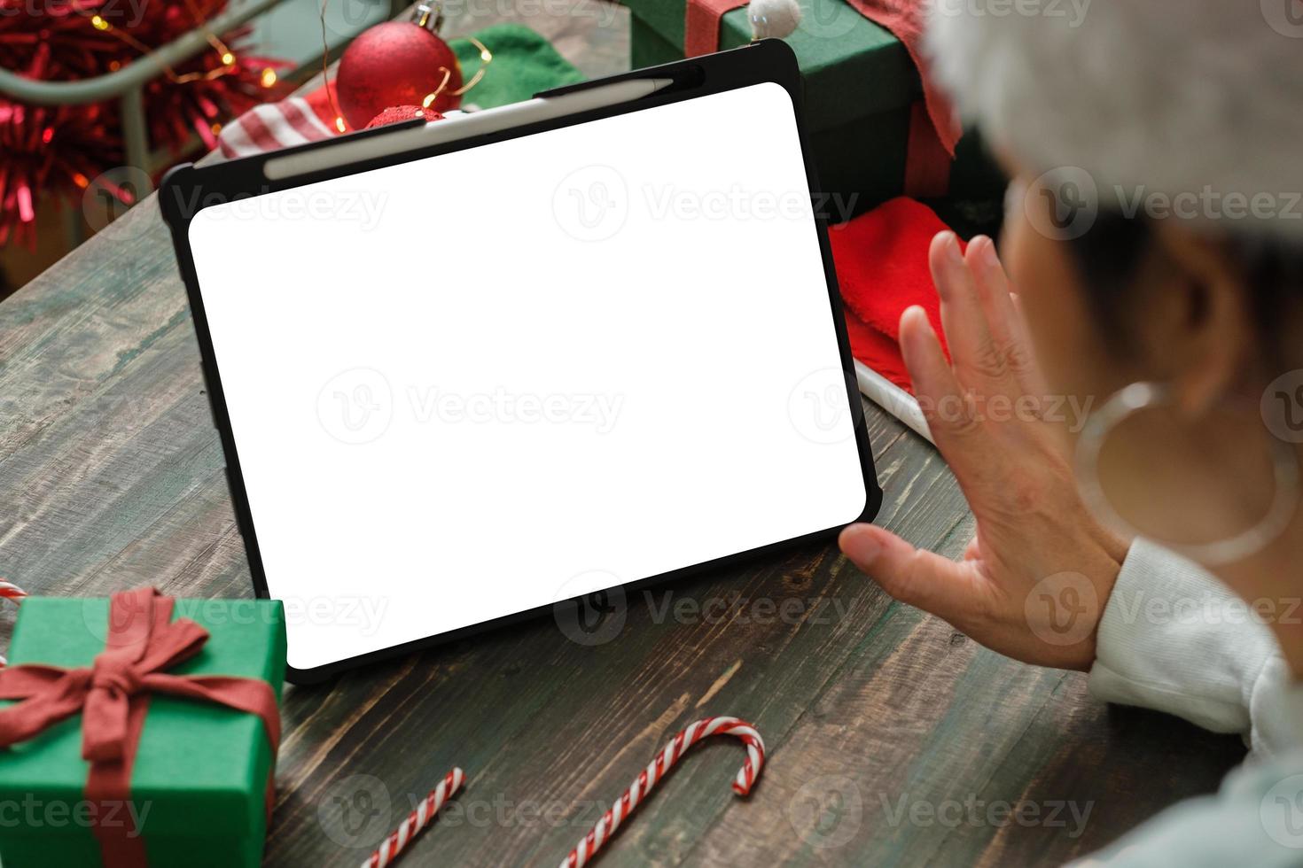 Christmas party video call with friends and toasting champagne party together at home.mock up screen photo