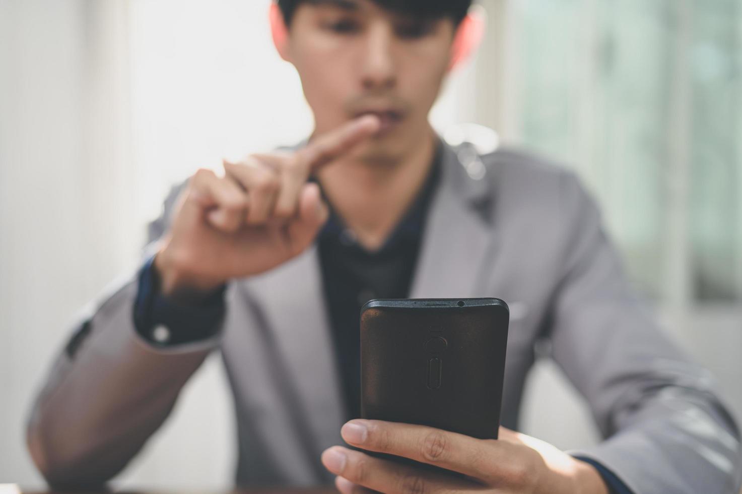Businessman using smart phone to work, communicate. photo