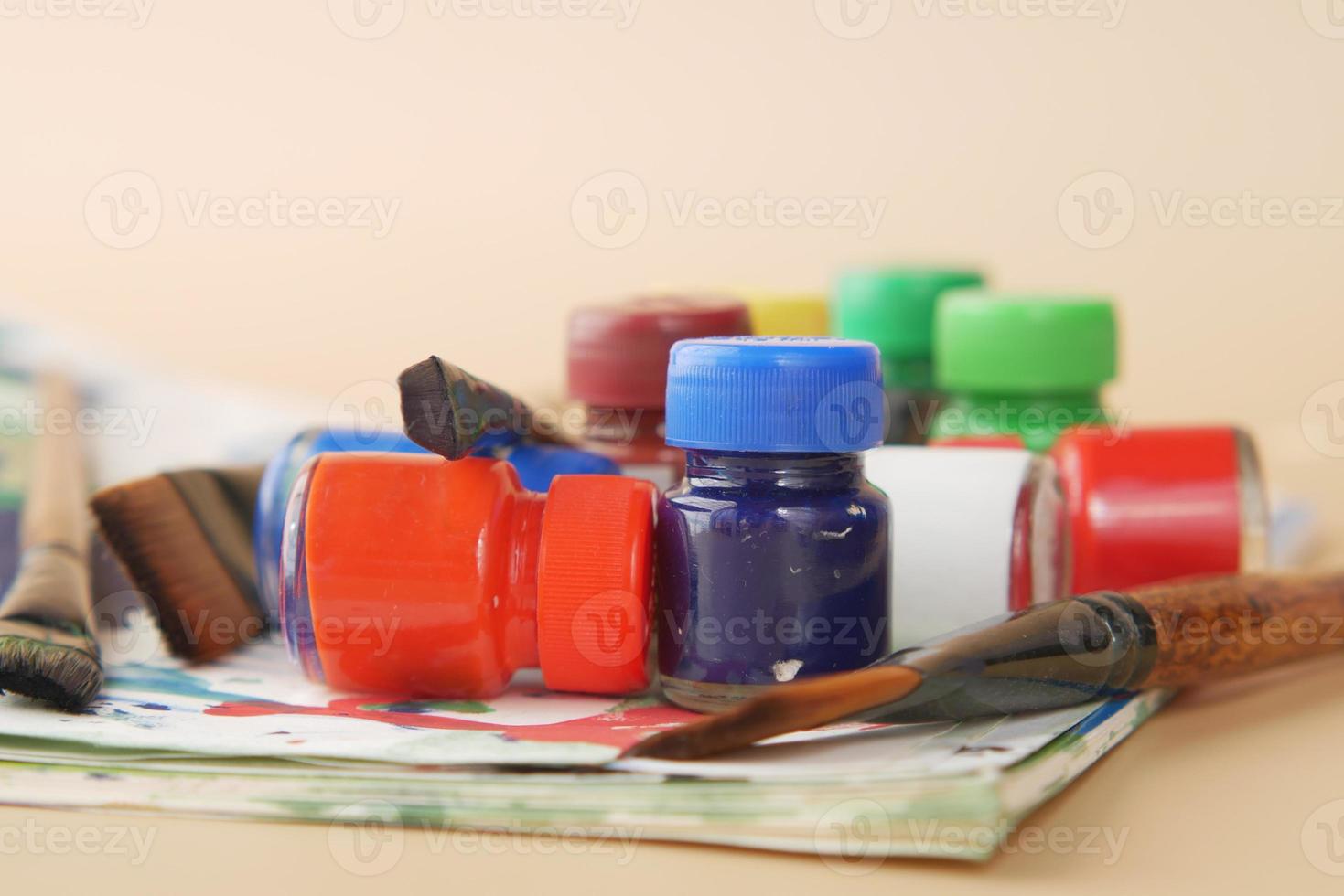 art brush and colors on a paper with copy space , photo