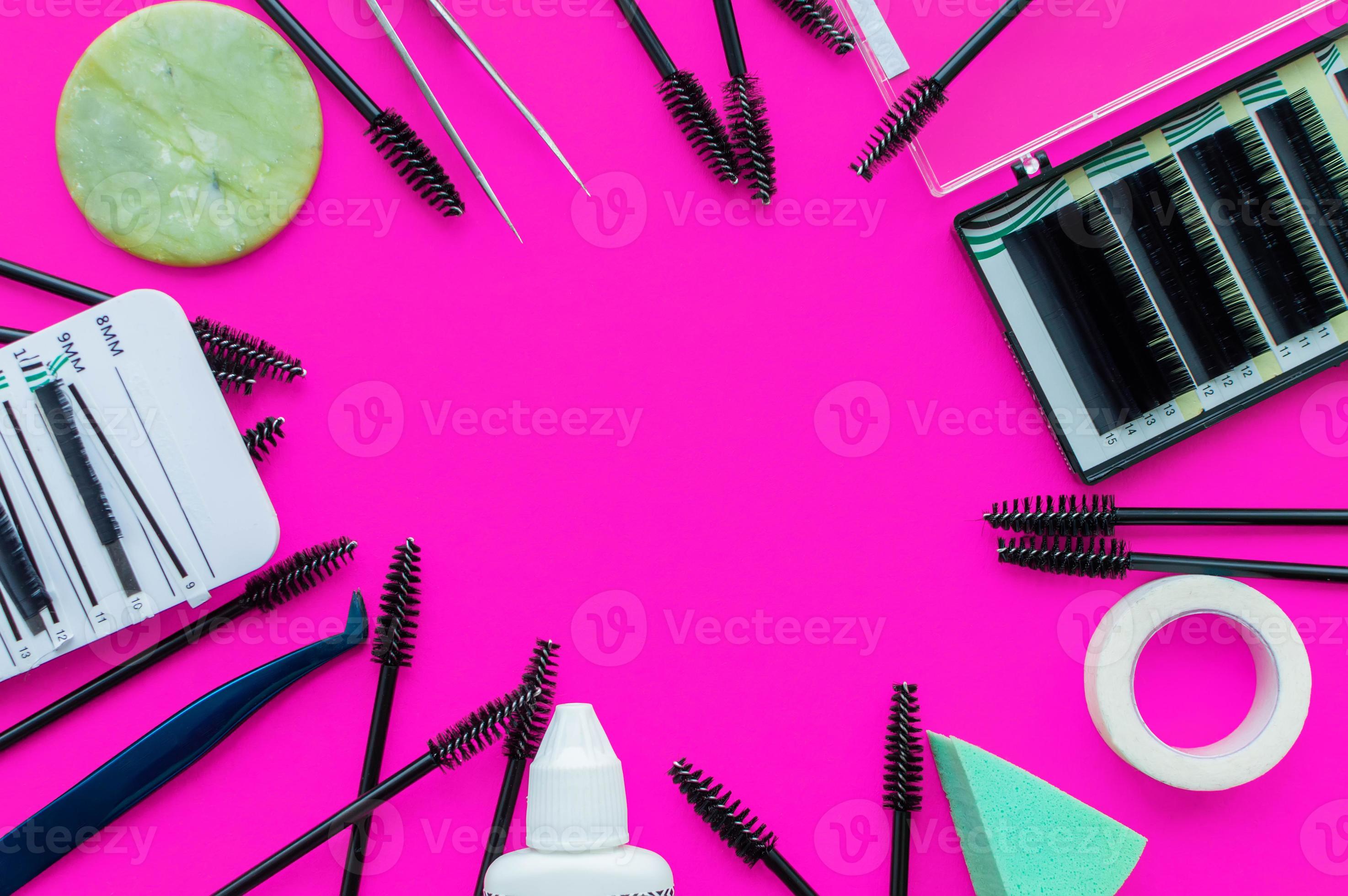 Template. Tools for eyelash extension on a pink background with a ...