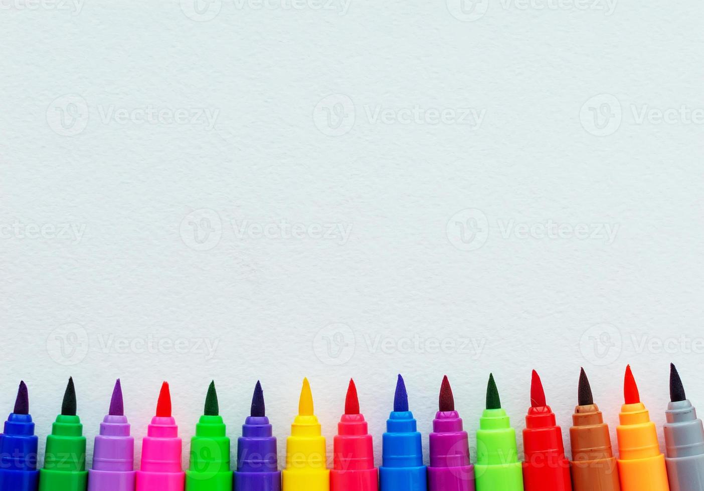 Template. Felt pens on a sheet with a place for inscription. View from above. photo