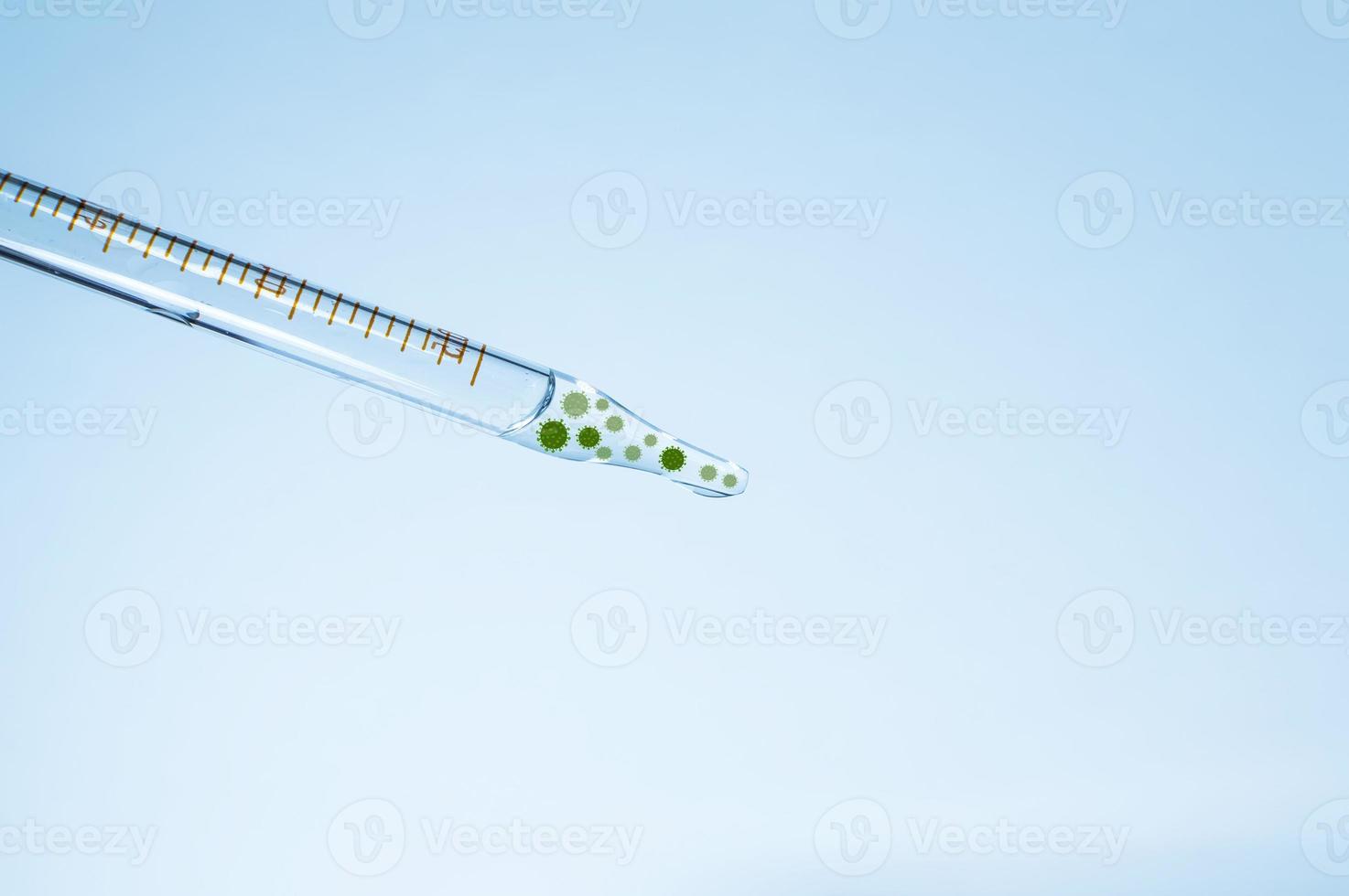 Medical laboratory. A pipette with a clear liquid and a virus on a blue background. Laboratory tests. Elements of a bitmap drawing. photo