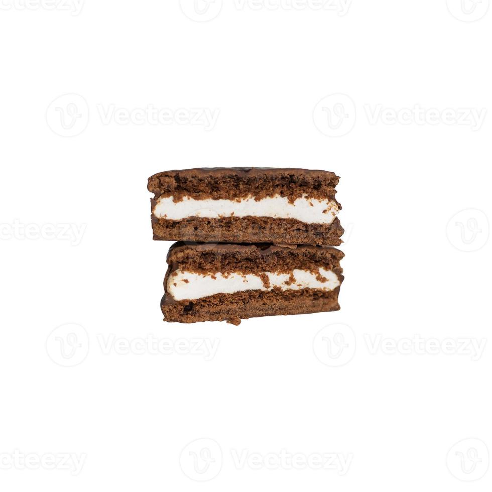 Slices of chocolate cookies with cream filling in chocolate glaze isolated on a white background. Top view. photo