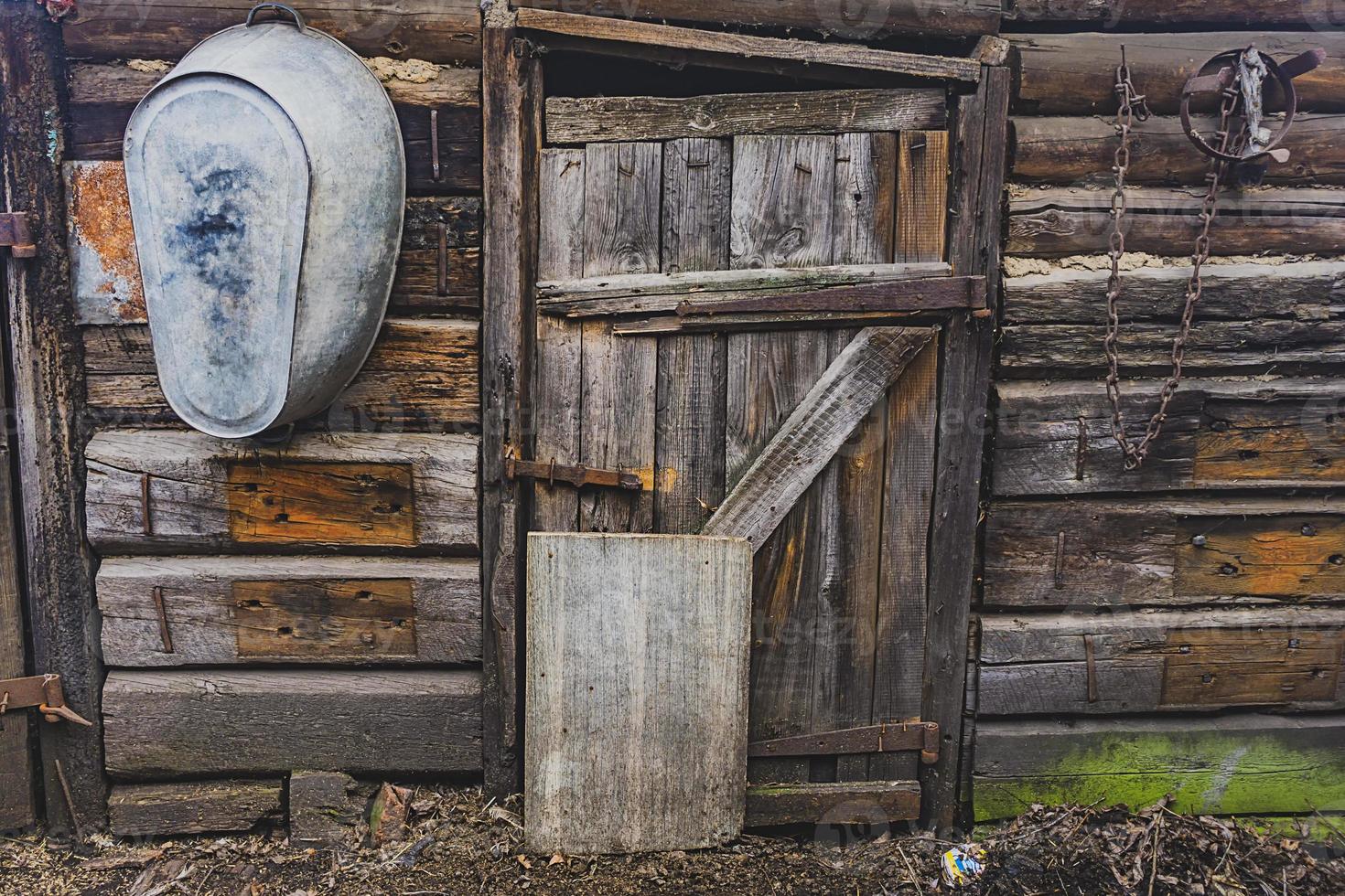 old wooden door of a collapsed barn. photo