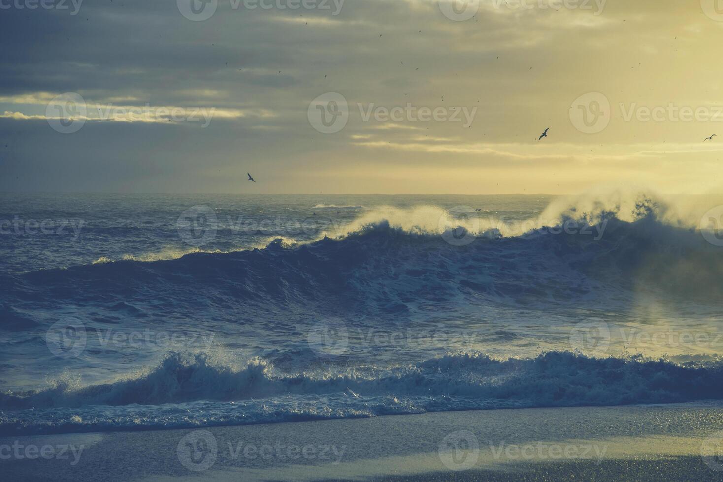 white snow in building beautiful sea winter ambiance with large blue sky in he sky surface hills. photo