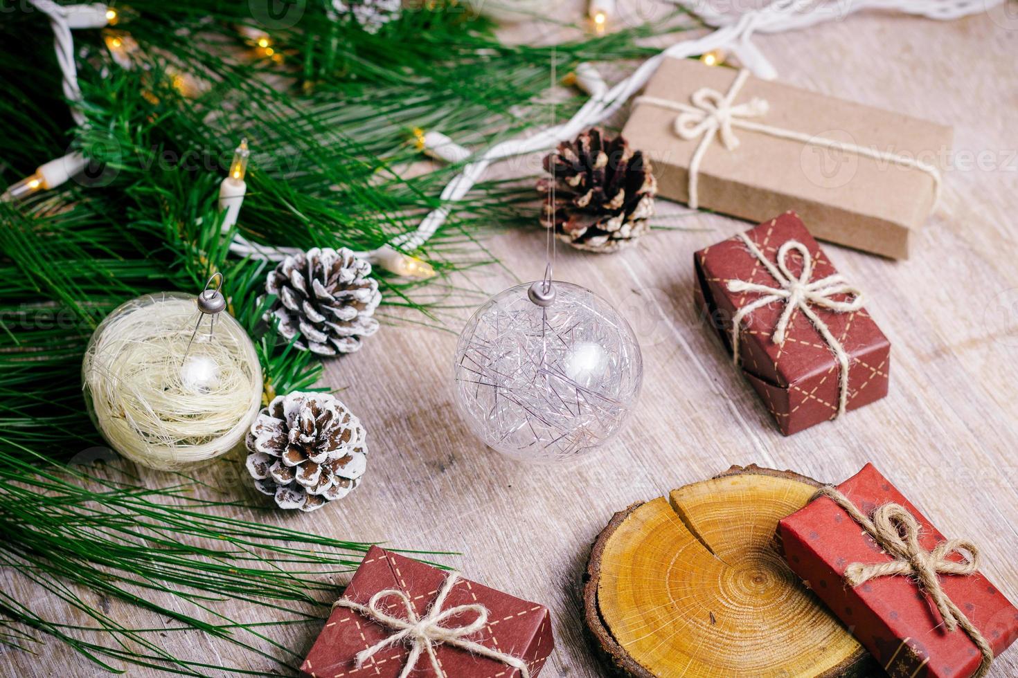 Mini christmas gifts on wooden background with warm and cold tones photo