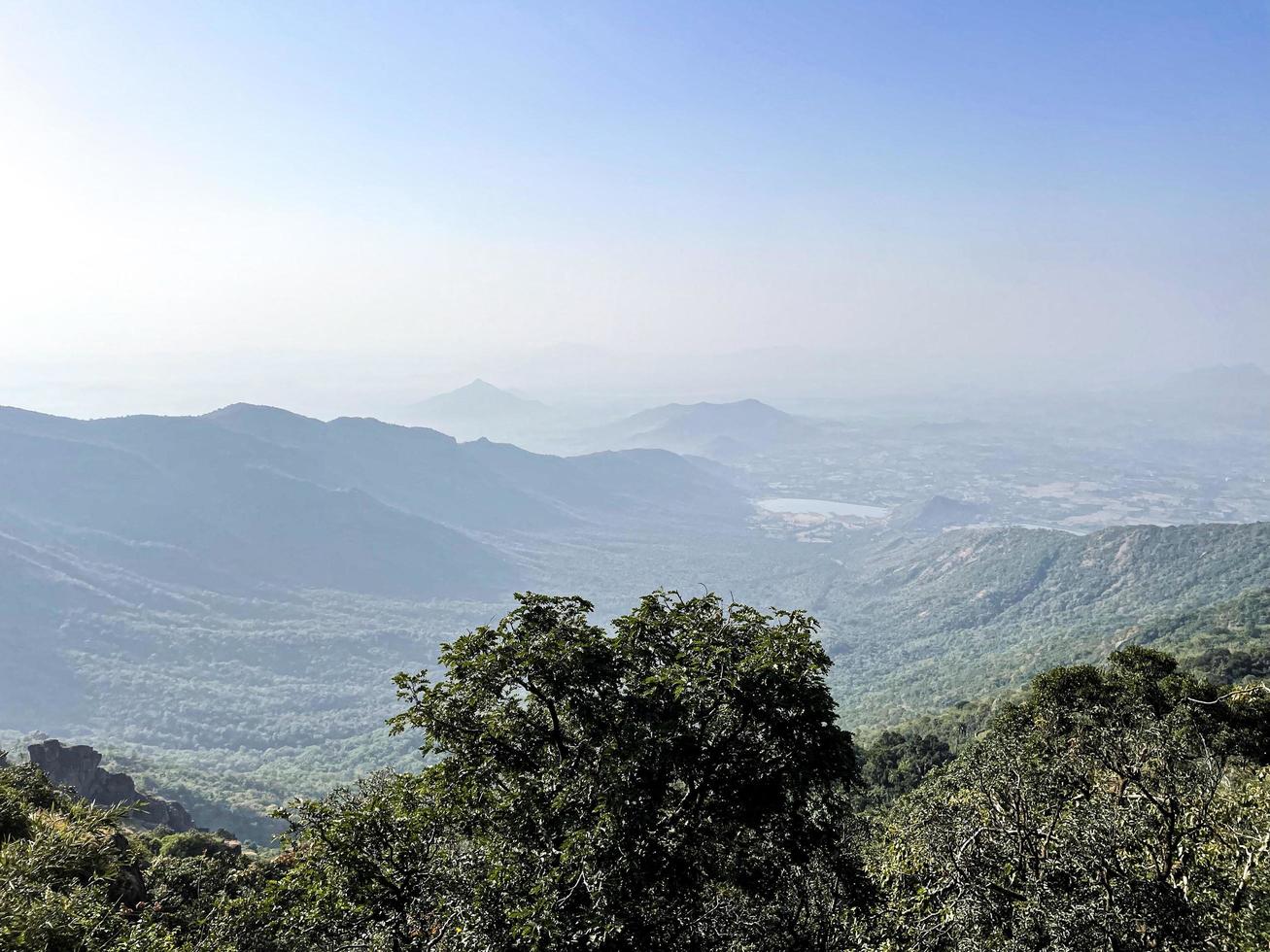 Green mountains under a blue sky photo