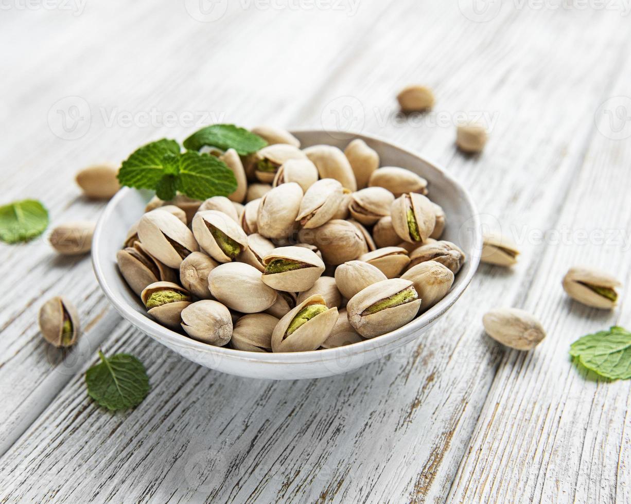 Bowl with pistachios photo