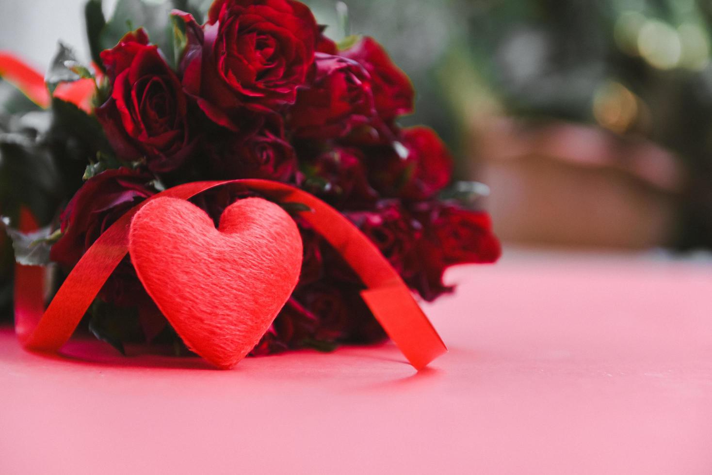 Flower roses bouquet on red background - Red heart with ribbon and rose romantic love valentine day concept photo
