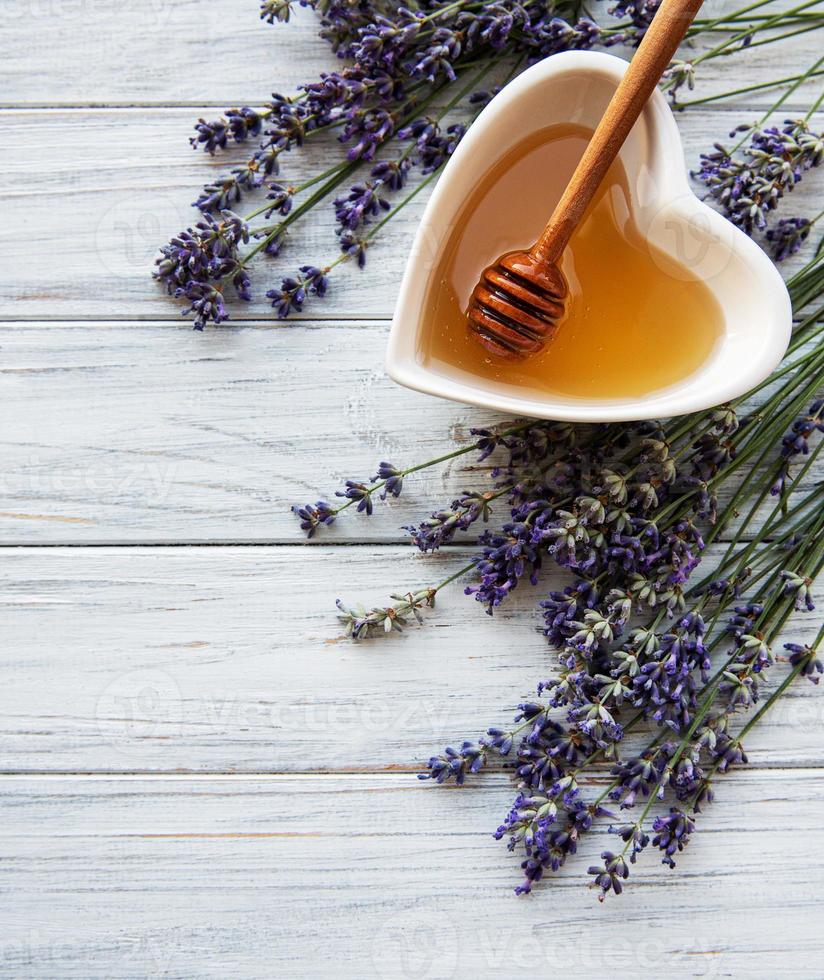 Bowl of honey with lavender photo