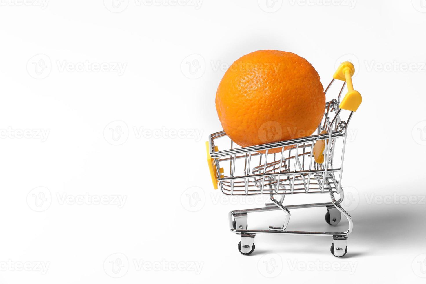 yellow basket filled with orange isolated on white background. citrus