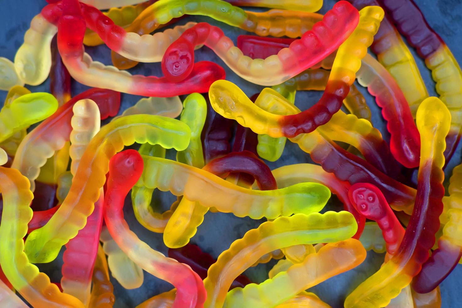 Colorful marmalade worms close-up. Top view. Background. photo