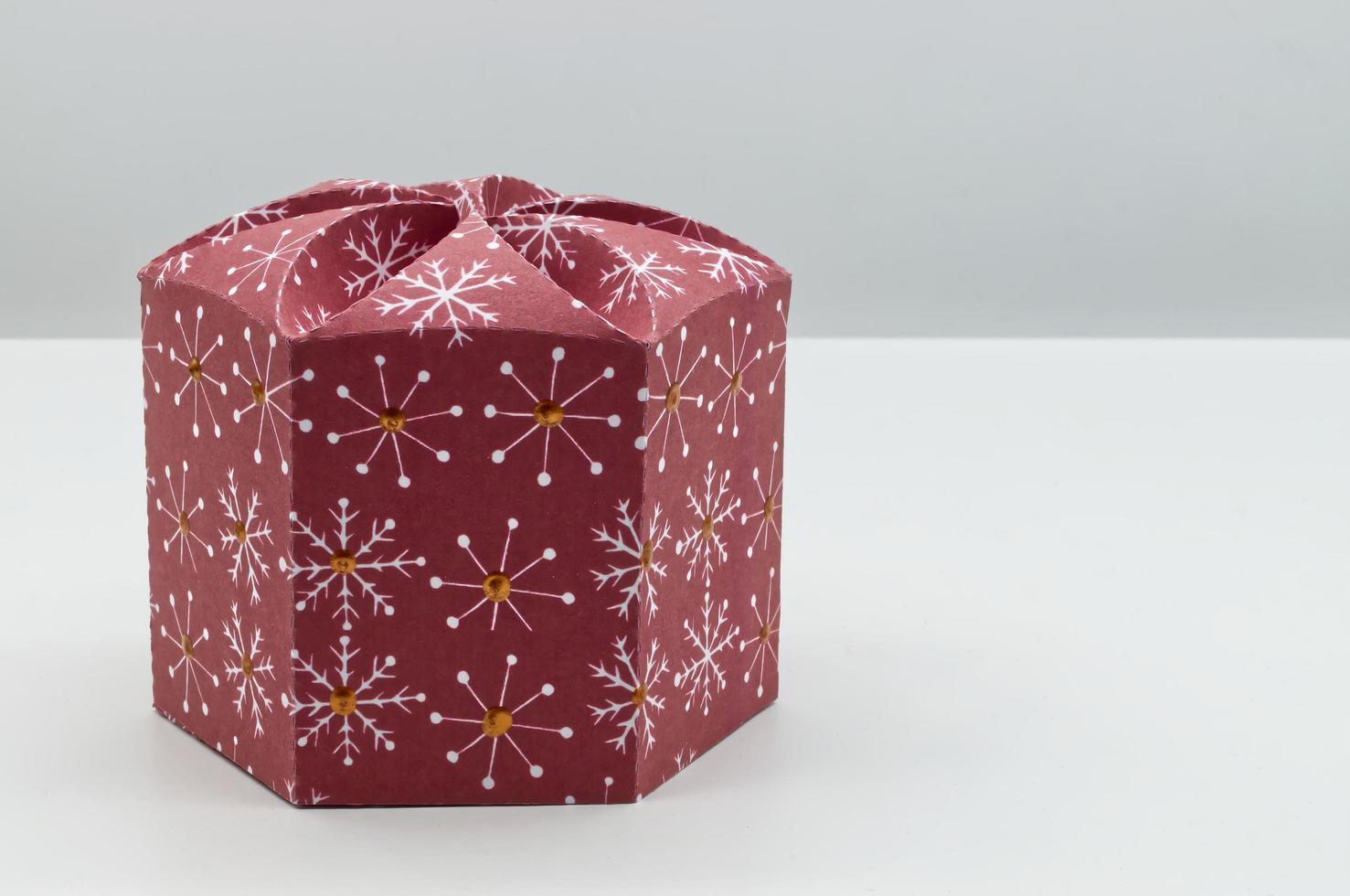 Christmas gift box, decorative festive object with space for your greetings. photo